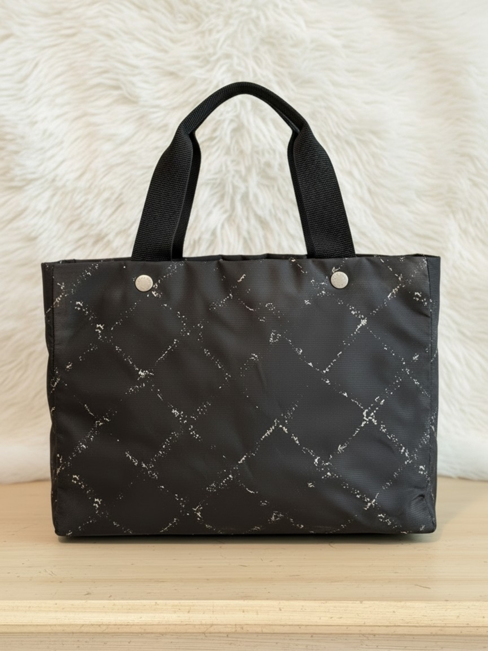 CHANEL Black Quilted-Effect Tote with Silver Accents